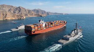 Container ship escorted through Strait of Hormuz after reopening