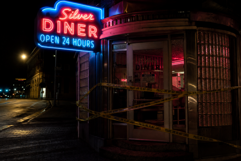 Police tape at a Chicago diner entrance following an armed robbery