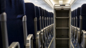 Empty airline service cart in economy cabin