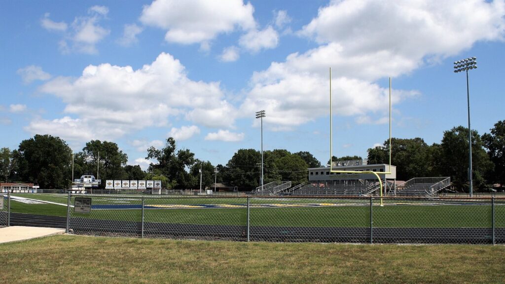 Empty high school football stadium in daylight