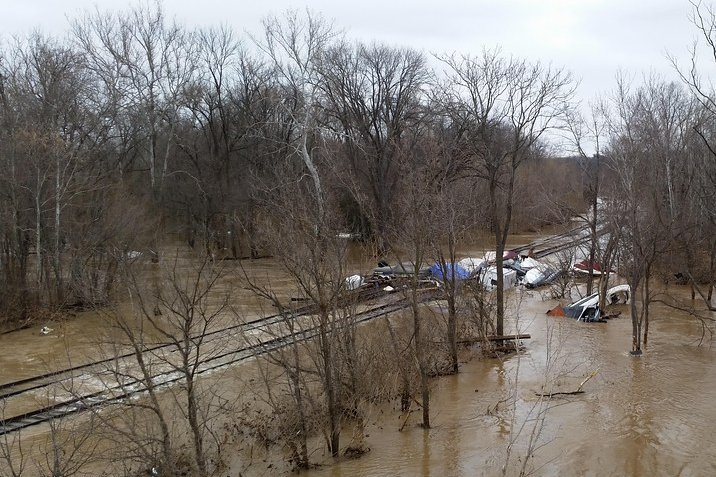 Flooded roadway with standing water after heavy rain